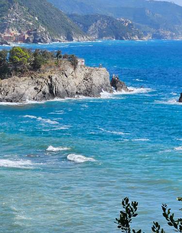 Coastal landscape view with sea and rocky cliffs.