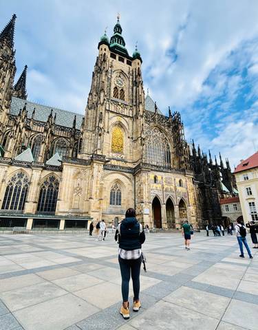 Tourists in front of St. Vitus Cathedral in Prague.
