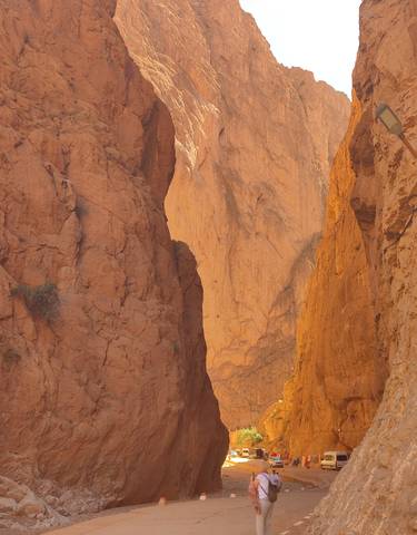 Canyon with orange-hued cliffs.