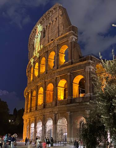 Colosseum illuminated against the night sky.
