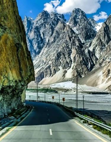 Curved road through a mountainous landscape.