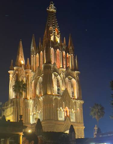 Illuminated gothic cathedral at night.