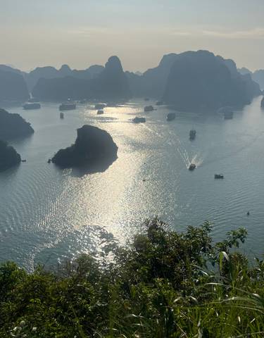 Aerial view of Halong Bay with boats on the water.
