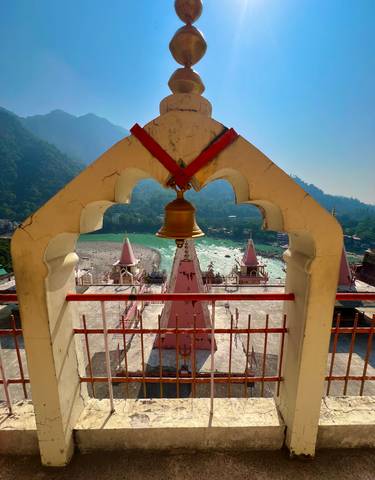 Temple view with a bell overlooking a river