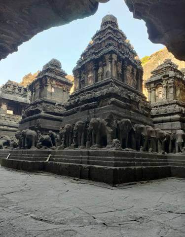 Ancient temple architecture with intricate carvings and statues.