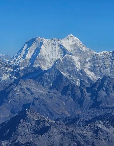 Snow-capped mountains under a clear blue sky.
