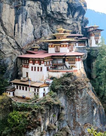 Taktsang Monastery perched on a rocky cliff.