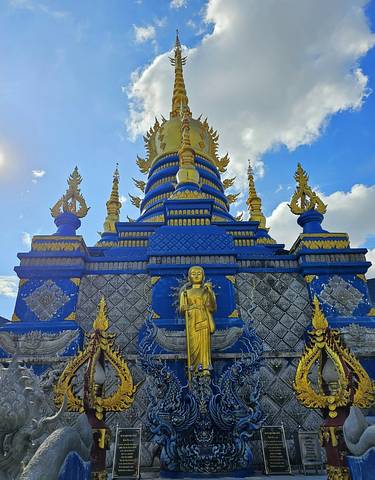 Colorful temple with golden figures and decorations.