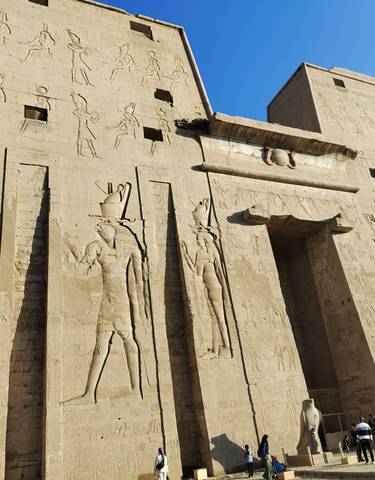 Close-up of an ancient Egyptian temple with carvings.