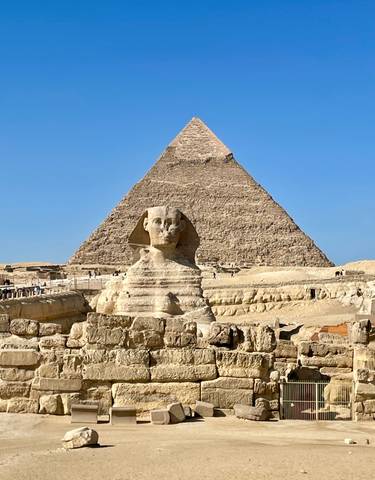 The Sphinx and Great Pyramid in Giza on a sunny day.