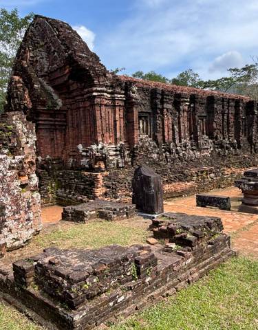 Historic ruins with people exploring.