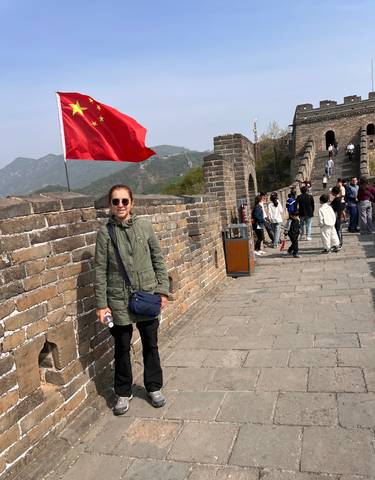 A person standing on the Great Wall of China.