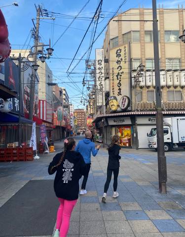 Street scene in a city with decorations and signs.