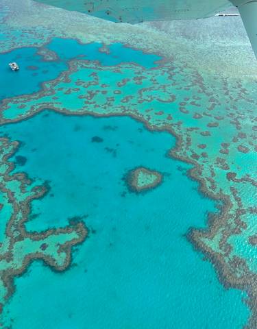 Aerial view of the Great Barrier Reef with turquoise waters.