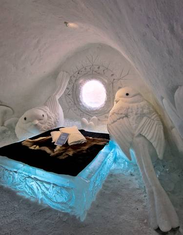 Snow and ice sculpture room with intricate carvings.