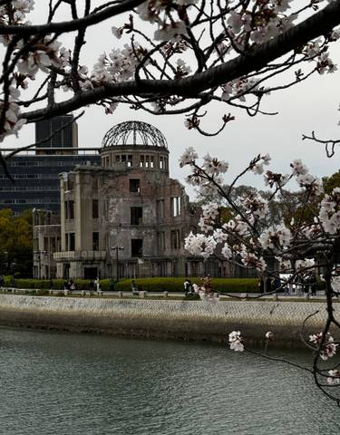 The Atomic Bomb Dome with cherry blossoms in foreground.