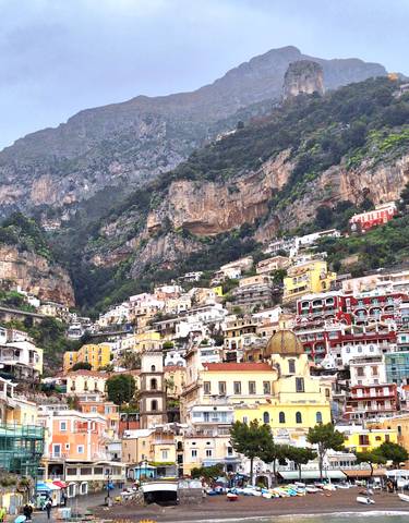 A hillside covered in colorful houses.