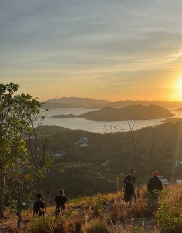 Sunset view over an island-dotted bay.