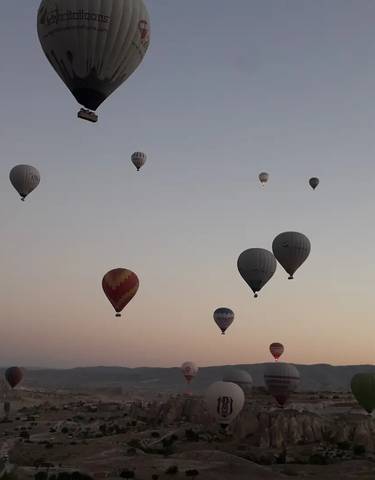 Hot air balloons in the sky at sunrise.
