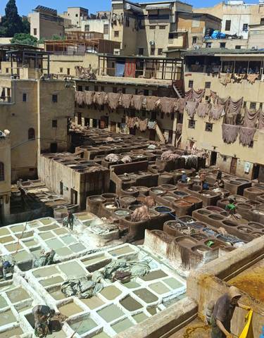 A traditional tannery with colorful dye vats.