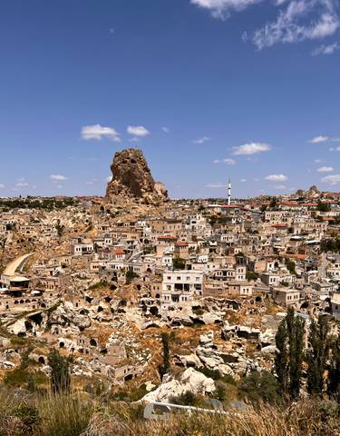 Wide view of an ancient town with distinct rock formations.
