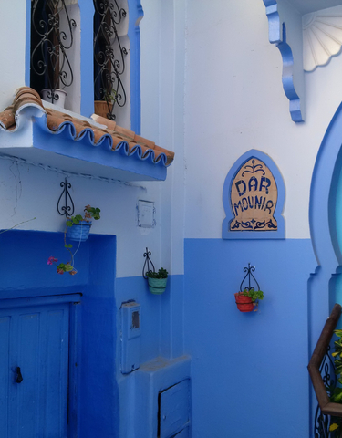 Charming blue and white building exterior in Chefchaouen.