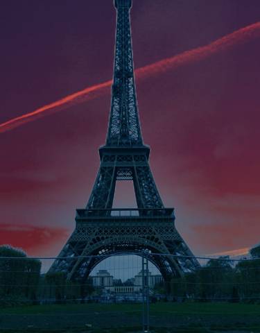 Eiffel Tower against a vivid sunset sky.