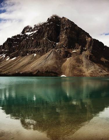 Mountain landscape with a reflective turquoise lake.