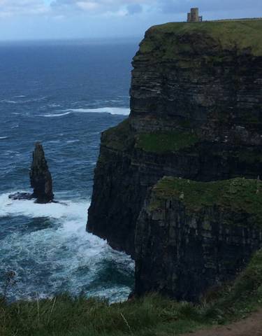 Cliffs of Moher with a sea stack in the foreground.