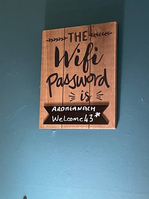       Upside-down image of a sign with WiFi password.
  