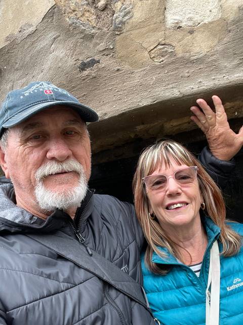 Upside-down image of two people taking a selfie.