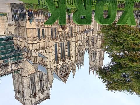 Gothic cathedral facade with green display.