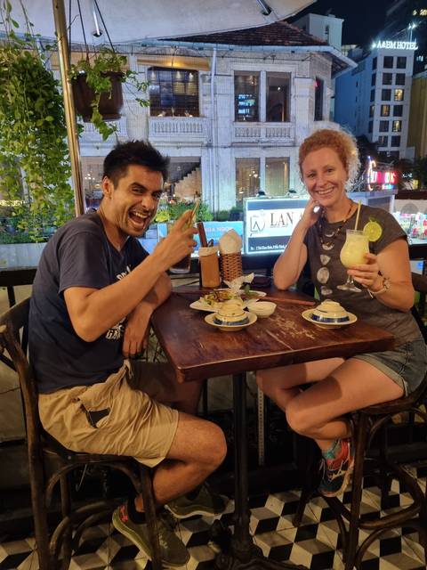 Two people enjoying a meal at a café.