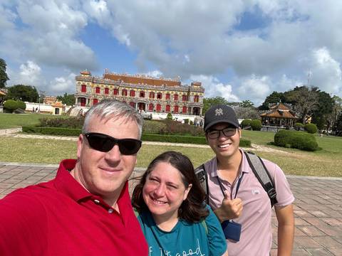       Upside-down image of a group of people at a historic site.
  