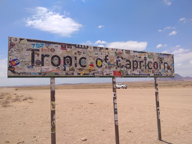 Tropic of Capricorn sign in a desert area.