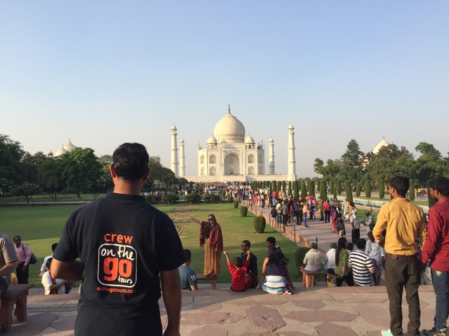       Tourists viewing the Taj Mahal.
  