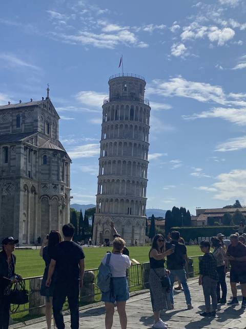 People taking photos at Pisa with the Leaning Tower.