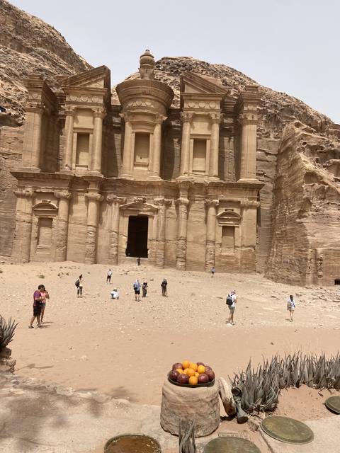       Petra's ancient architecture with tourists.
  