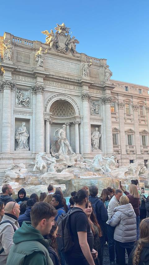 Crowded Trevi Fountain in Rome, Italy.
