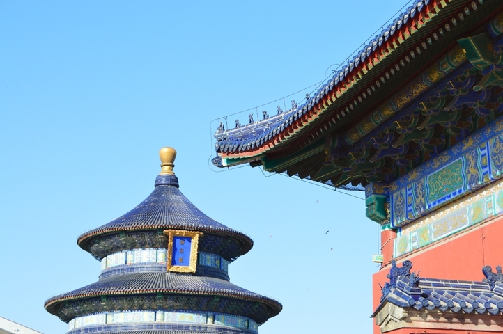 Traditional Chinese architectural detail with a bright blue sky.