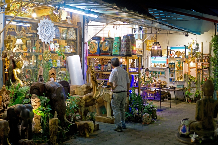 Market scene with various handmade goods on display.