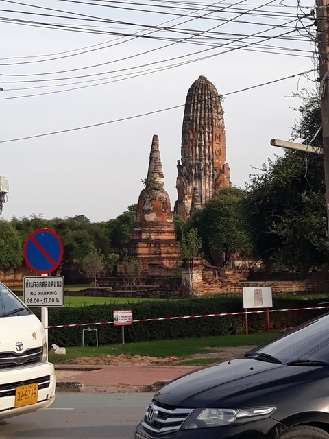      Ruins with historic brick structures and a traffic sign.
  