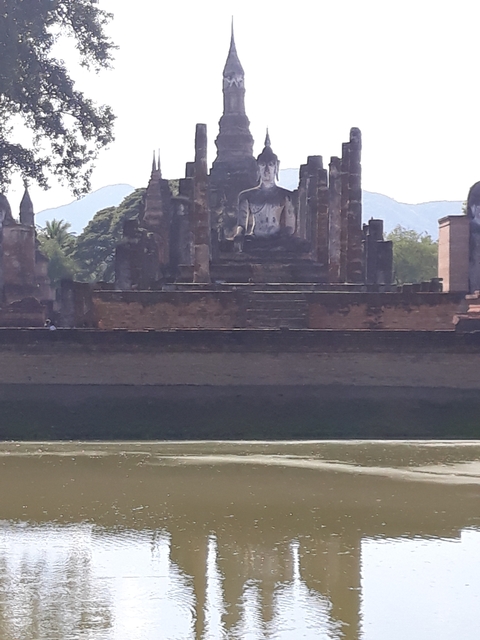 Temple ruins with water in the foreground.
