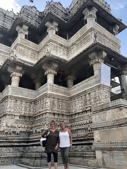       Intricately carved stone temple with detailed sculptures.
  