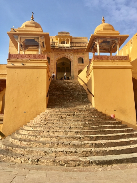 Staircase at a historical site with visitors.