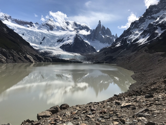       Mountain range with glacier and lake.
  