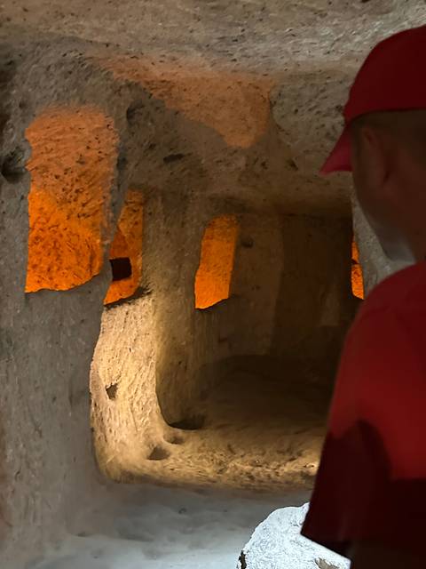       Underground cave with subtle orange lighting.
  