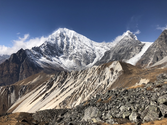       Snow-capped mountain peaks under a clear sky.
  