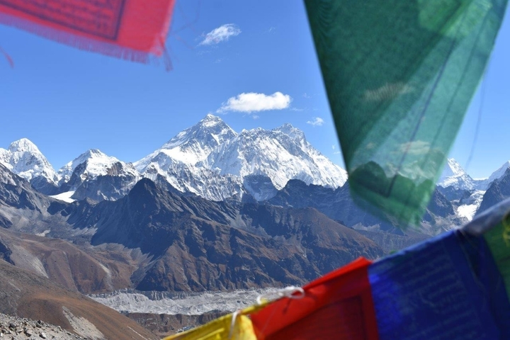 Himalayan mountain range with prayer flags.