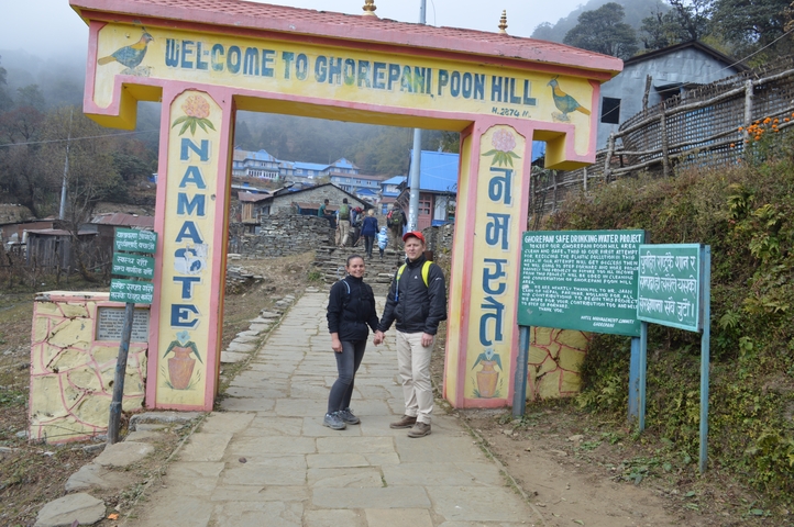       Couple holding hands at the Poon Hill entrance.
  